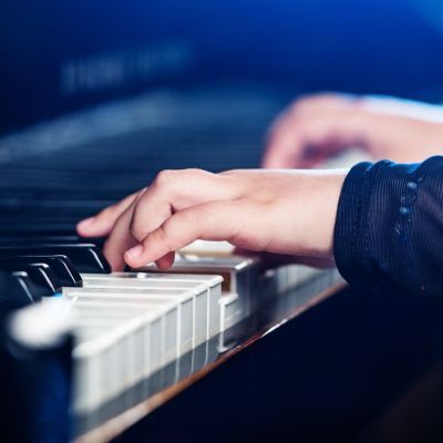 Hands playing piano